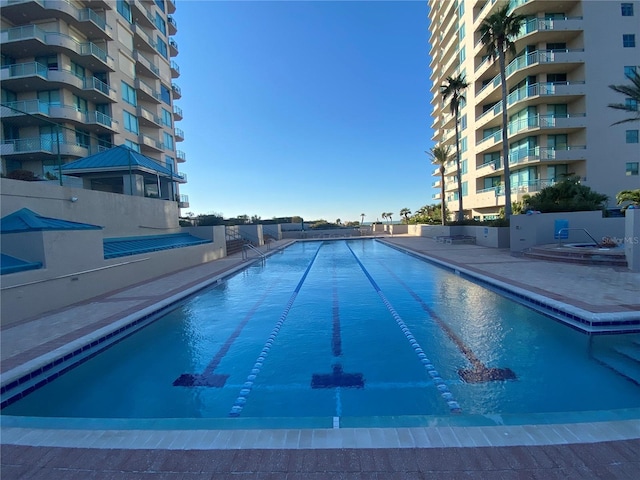 view of swimming pool with a patio area