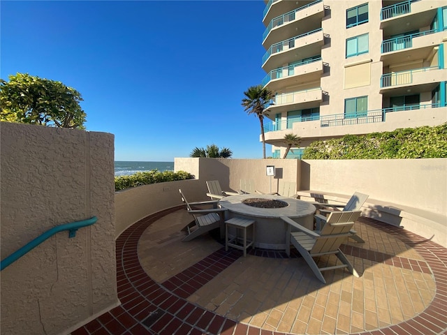 view of patio with a water view