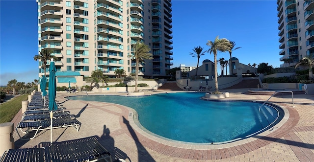 view of swimming pool featuring a patio