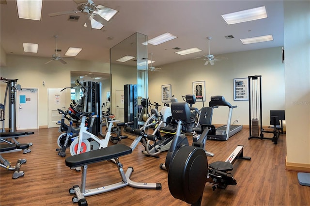 gym featuring ceiling fan and hardwood / wood-style floors