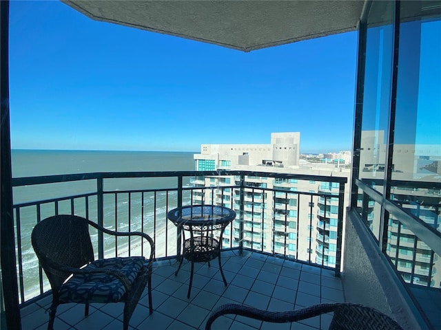 balcony featuring a water view