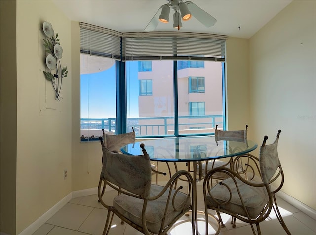 dining room with ceiling fan and light tile patterned floors