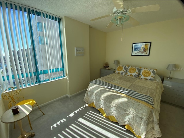 bedroom with light carpet, a textured ceiling, and ceiling fan