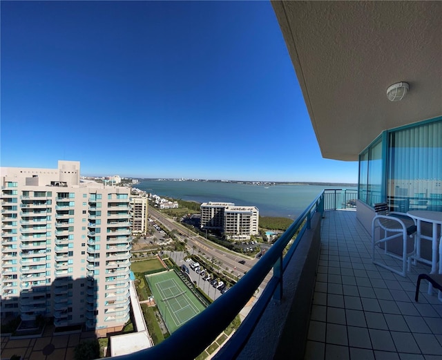 balcony featuring a water view