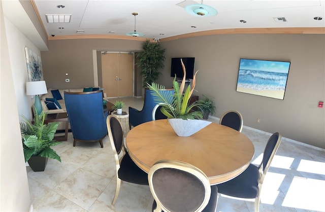 dining area featuring lofted ceiling