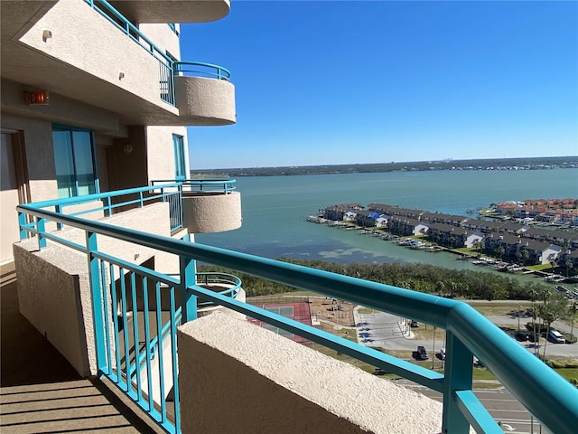 balcony featuring a water view