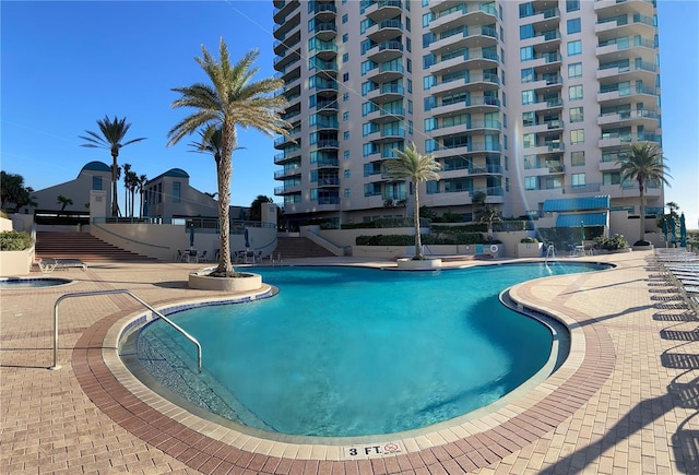 view of pool featuring a patio area