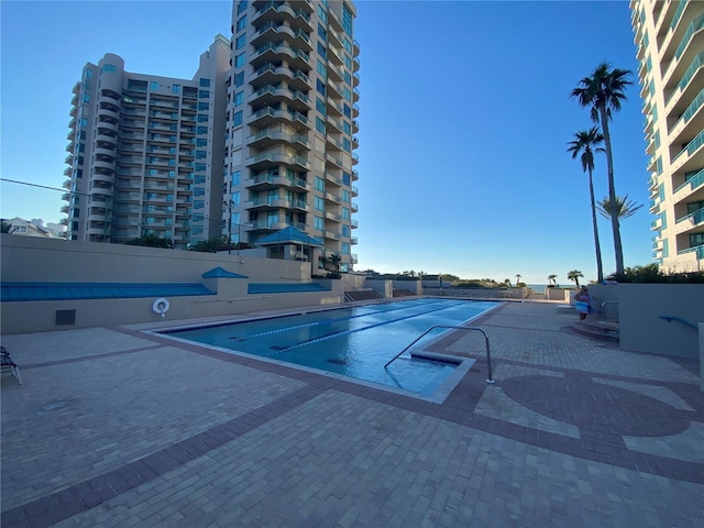 view of pool featuring a patio