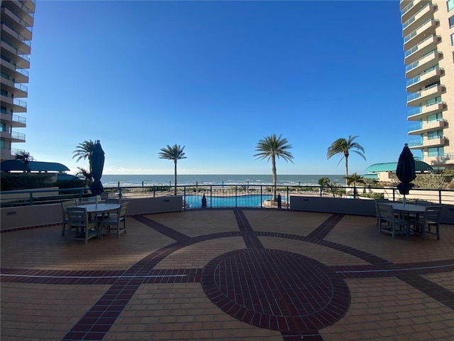 view of patio with a water view