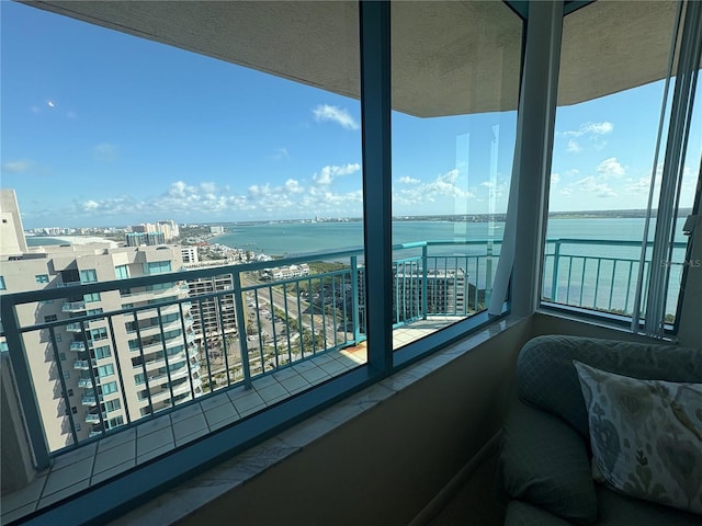 balcony featuring a water view