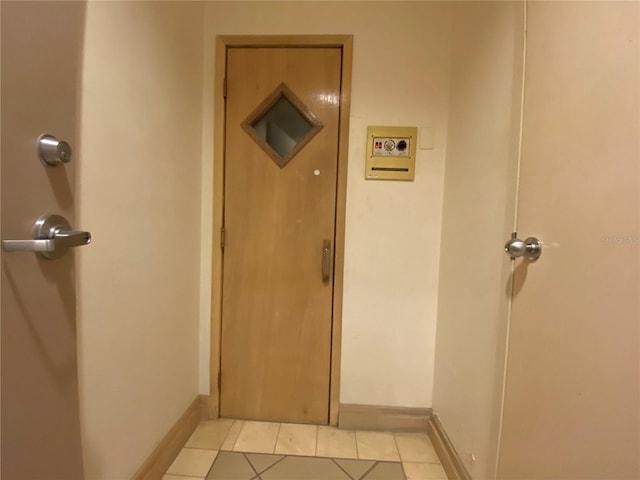 hallway with light tile patterned flooring
