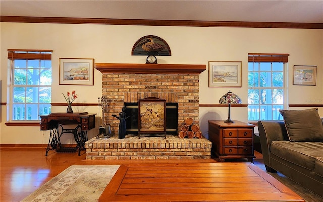 living room with hardwood / wood-style floors, a wealth of natural light, and ornamental molding