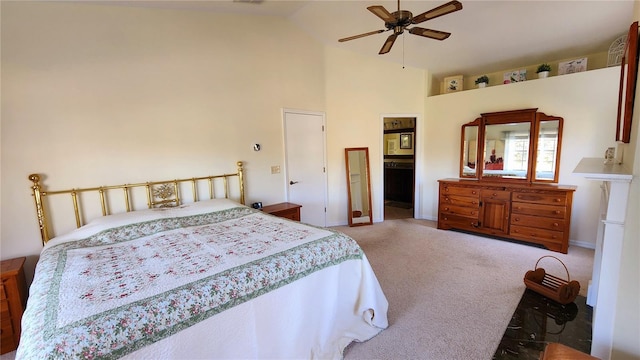 carpeted bedroom featuring ceiling fan and high vaulted ceiling