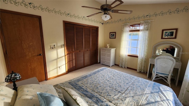 carpeted bedroom with ceiling fan and lofted ceiling