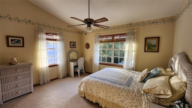 bedroom featuring multiple windows, ceiling fan, carpet, and vaulted ceiling