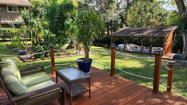 deck featuring outdoor lounge area and a lawn