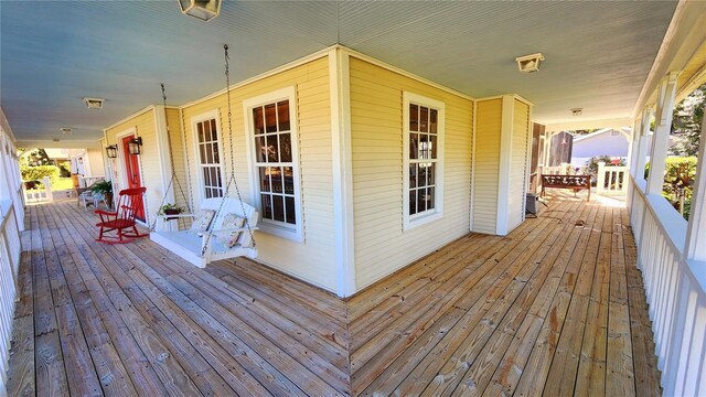 wooden deck featuring a porch