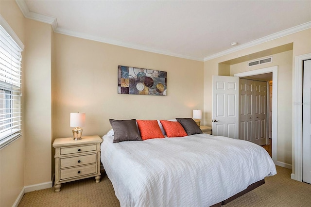 bedroom with crown molding, light carpet, and a closet