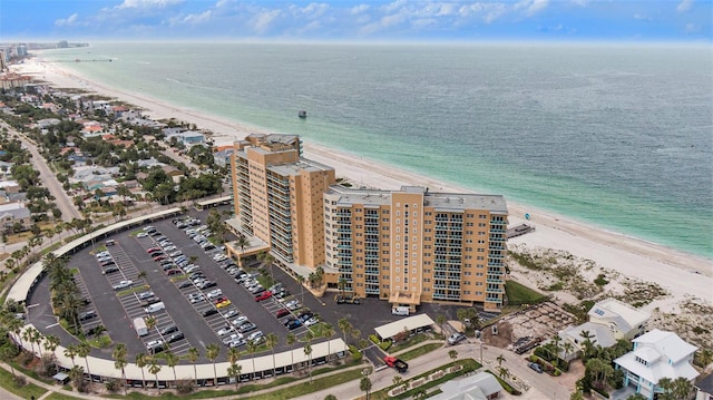 birds eye view of property featuring a view of the beach and a water view