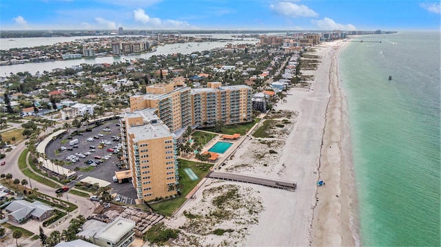 bird's eye view with a water view and a beach view