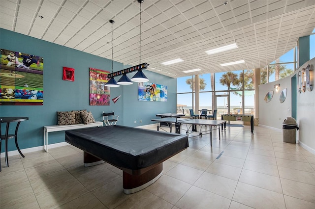 game room with tile patterned flooring, floor to ceiling windows, and pool table