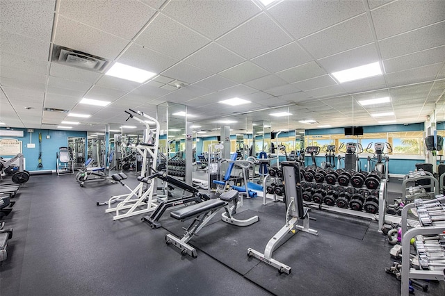 workout area with a paneled ceiling