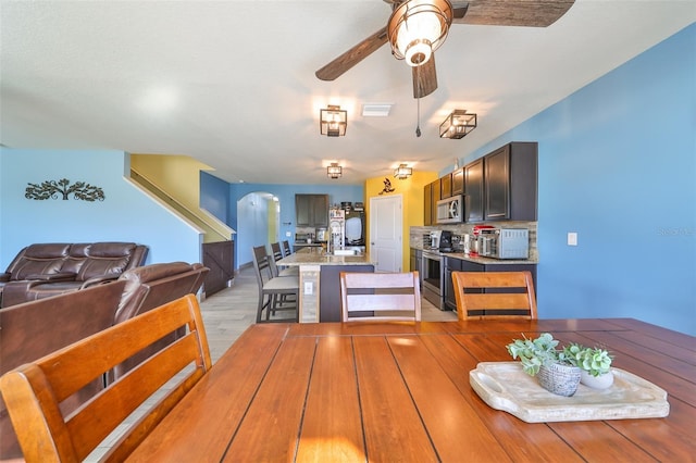 dining space featuring ceiling fan and light hardwood / wood-style flooring