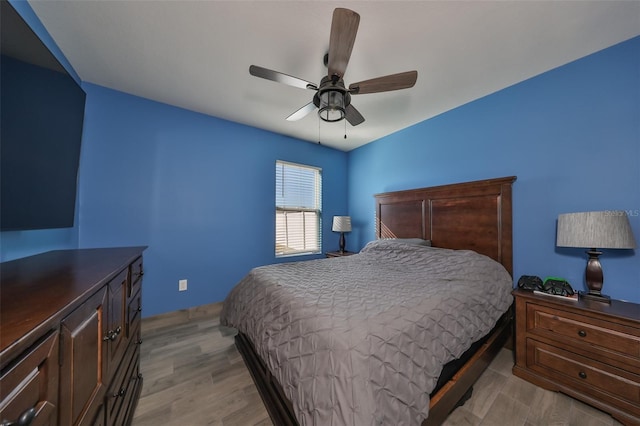 bedroom featuring ceiling fan and light hardwood / wood-style flooring