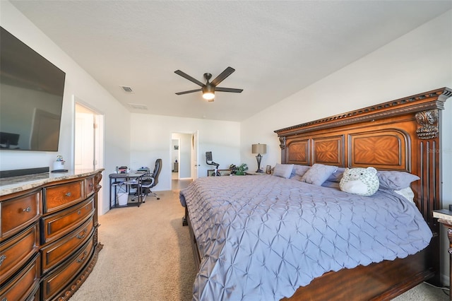 bedroom featuring ceiling fan and light colored carpet