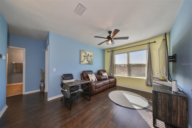 living room with dark hardwood / wood-style floors and ceiling fan