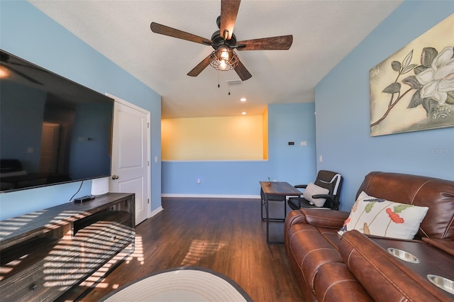 living room with ceiling fan and dark hardwood / wood-style floors