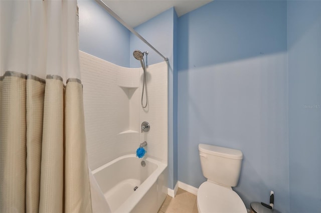 bathroom with tile patterned flooring, shower / bath combo, and toilet