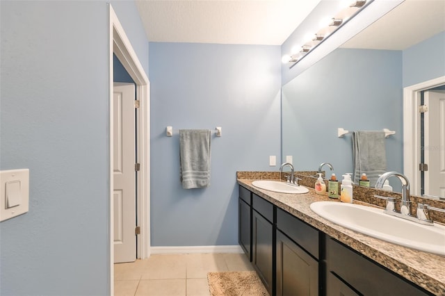 bathroom featuring tile patterned flooring and vanity