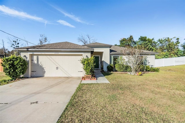 ranch-style house with a garage and a front lawn