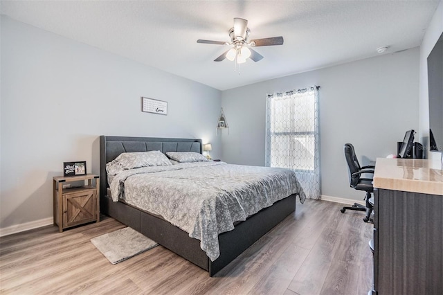 bedroom featuring ceiling fan and light wood-type flooring