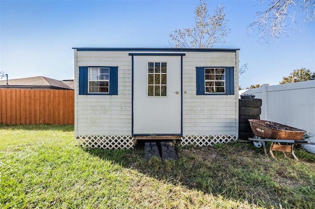 view of outdoor structure with a lawn