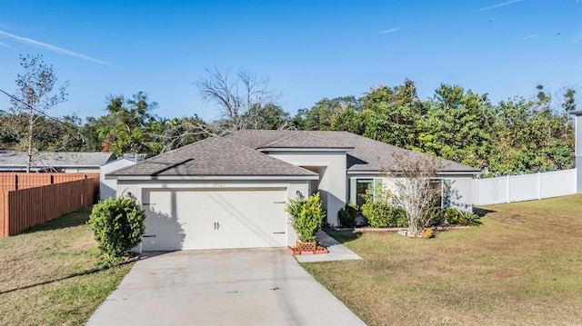 view of front facade featuring a front lawn and a garage