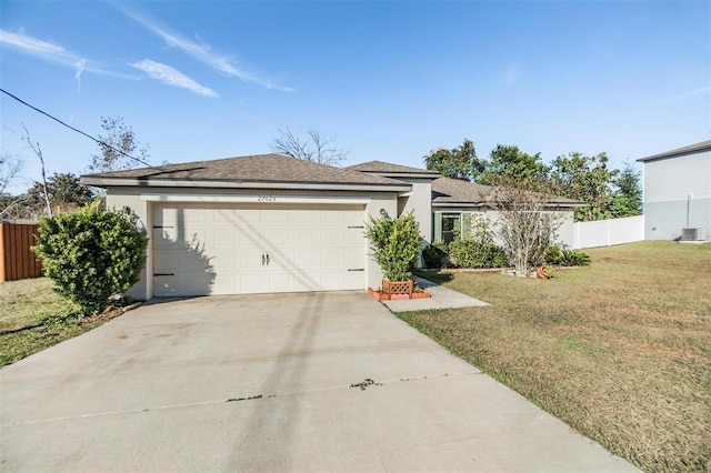 ranch-style house with a front lawn and a garage