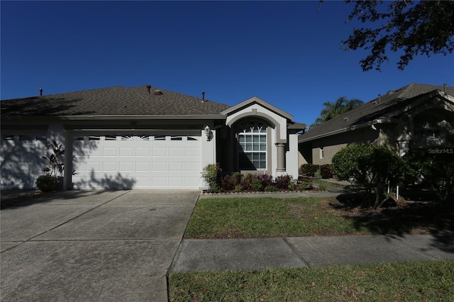 ranch-style house featuring a garage