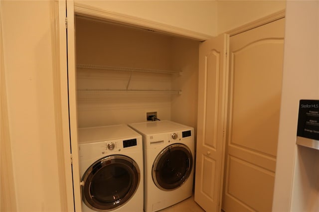 laundry room with washer and clothes dryer