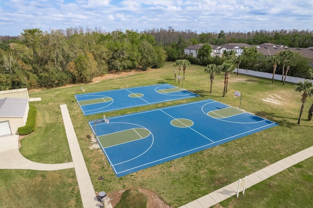 view of sport court featuring community basketball court and a yard
