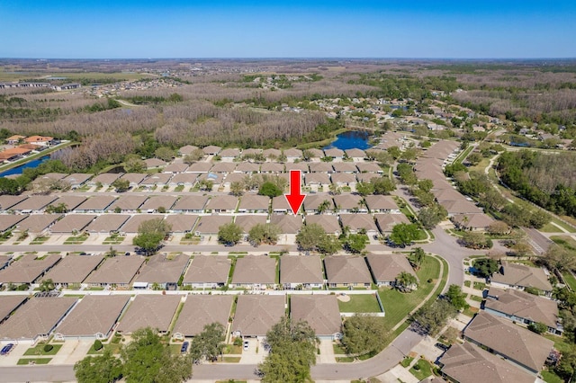 bird's eye view with a residential view and a water view