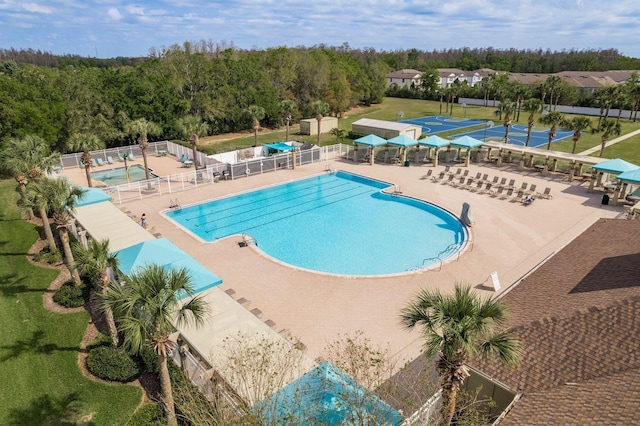 pool featuring a patio area and fence