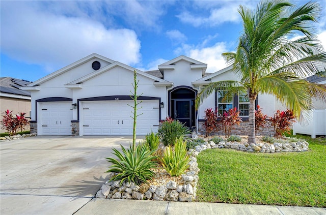 view of front of home featuring a front lawn and a garage