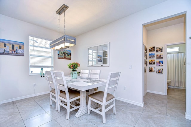 dining area with light tile patterned floors