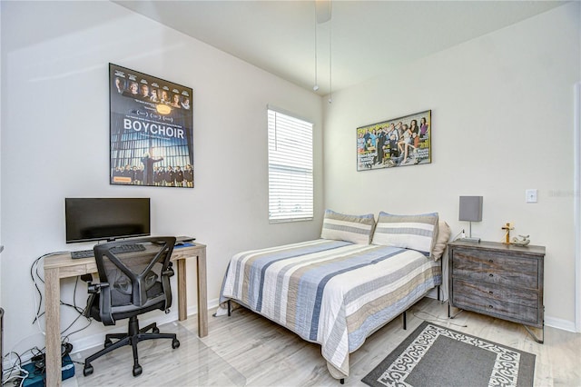 bedroom featuring wood-type flooring and ceiling fan