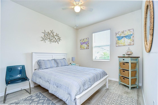 bedroom featuring hardwood / wood-style flooring and ceiling fan