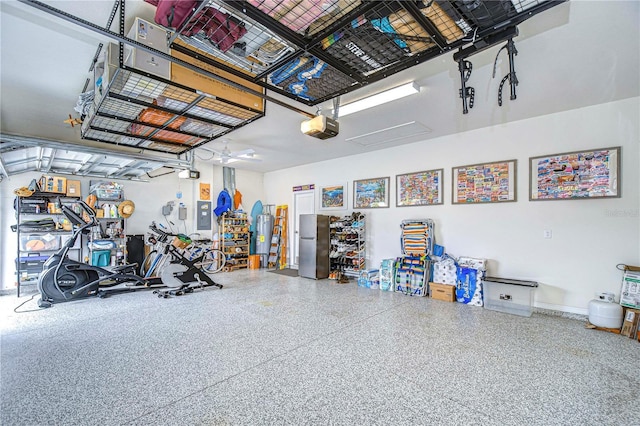 garage featuring stainless steel fridge and a garage door opener