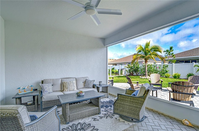 view of patio / terrace with an outdoor living space and ceiling fan