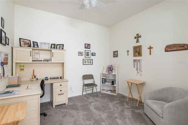 carpeted office featuring ceiling fan